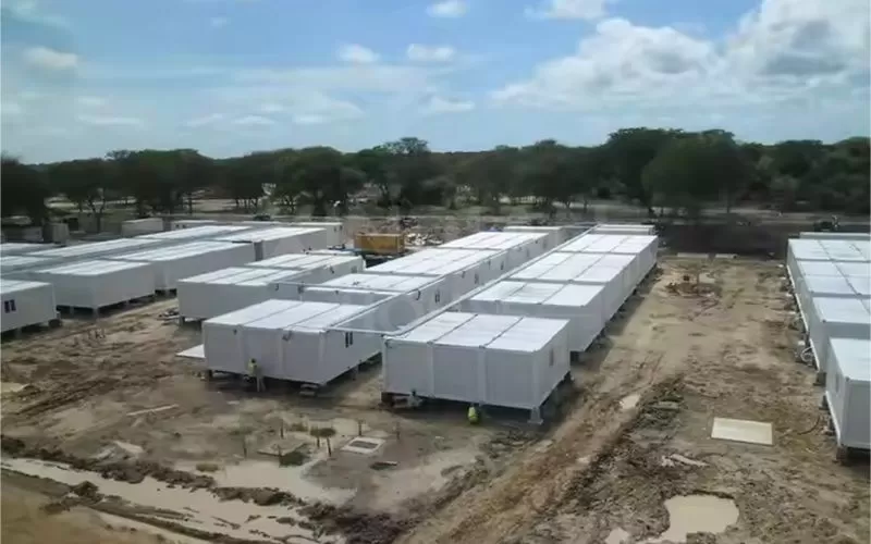 Modular containerized housing for disaster relief camps