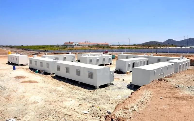 Modular containerized housing for disaster relief camps