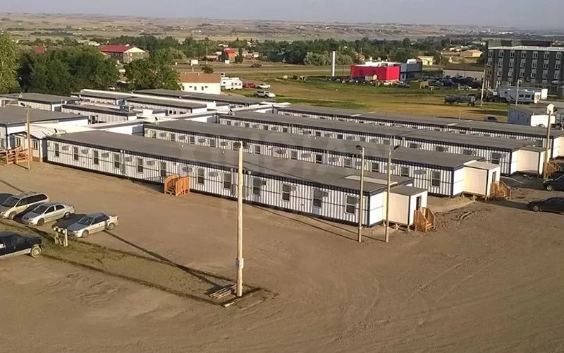 Modular containerized housing for disaster relief camps